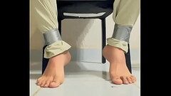Casual gay man with his feet tape tied (Part 2) Thumb